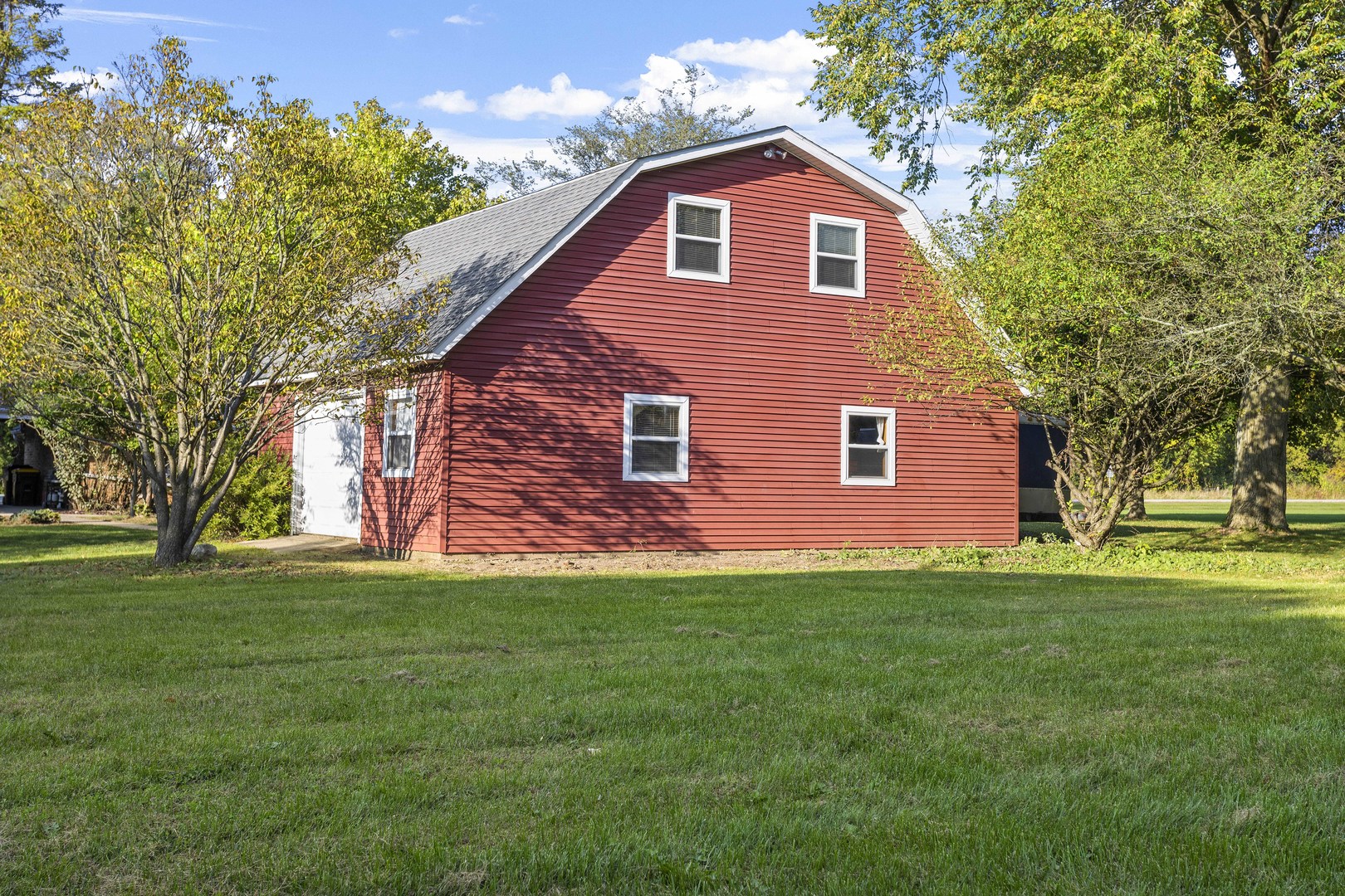 21517 Dunham Road Harvard, IL 60033 - Photo 24 of 36 a front view of a house with a garden