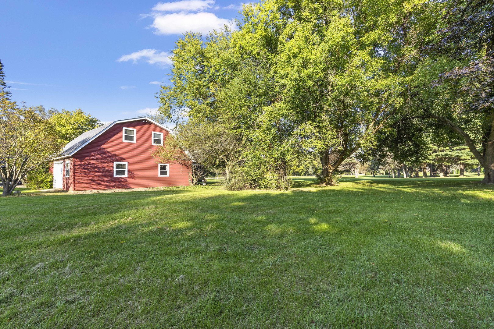 21517 Dunham Road Harvard, IL 60033 - Photo 31 of 36 a view of a tree in front of a house