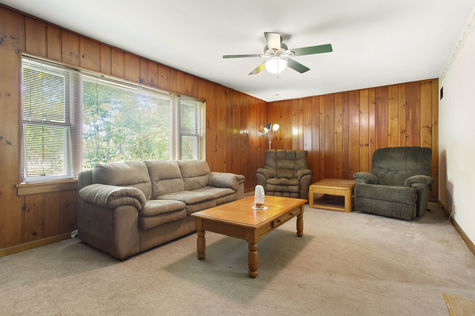 21517 Dunham Road Harvard, IL 60033 - Photo 5 of 36 a living room with furniture and a large window