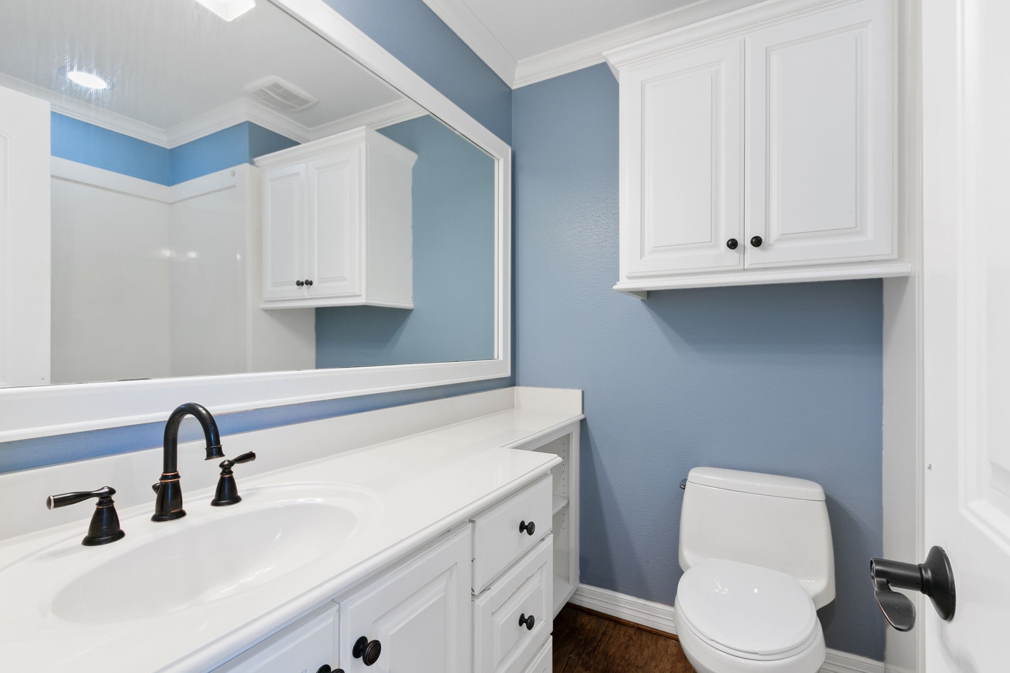 17018 Grant Road Cypress, TX 77429 - Photo 27 of 50 a bathroom with a toilet sink and mirror