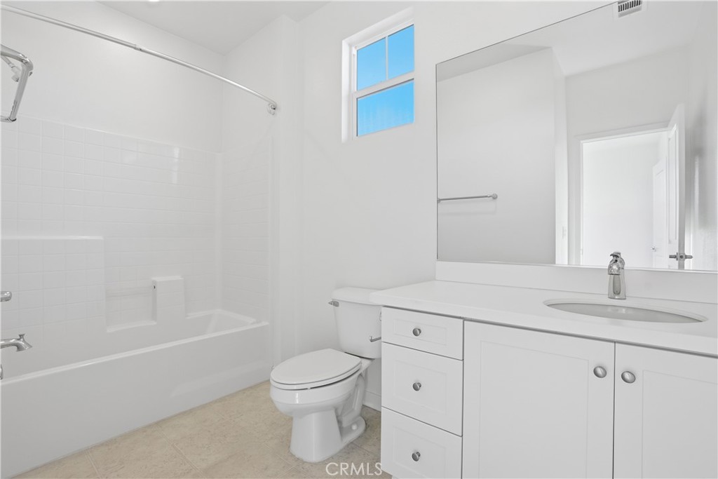 179 Patria Rancho Mission Viejo, CA 92694 - Photo 20 of 75 a bathroom with a sink a toilet and vanity