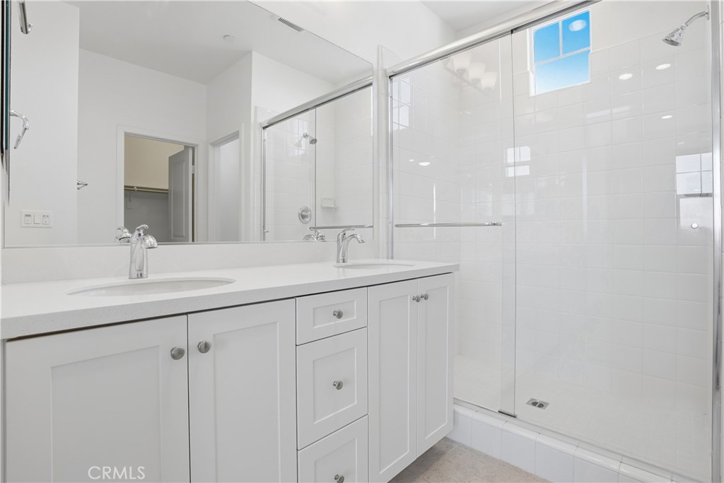179 Patria Rancho Mission Viejo, CA 92694 - Photo 26 of 75 a bathroom with a double vanity sink a and mirror