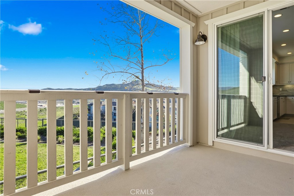 179 Patria Rancho Mission Viejo, CA 92694 - Photo 34 of 75 a view of a porch with a floor to ceiling window and stairs