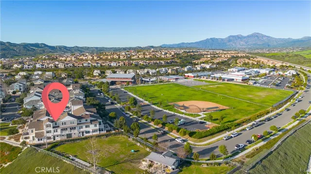 a kitchen with stainless steel appliances granite countertop white cabinets a refrigerator and a stove