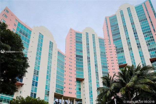 a view of a city with tall buildings