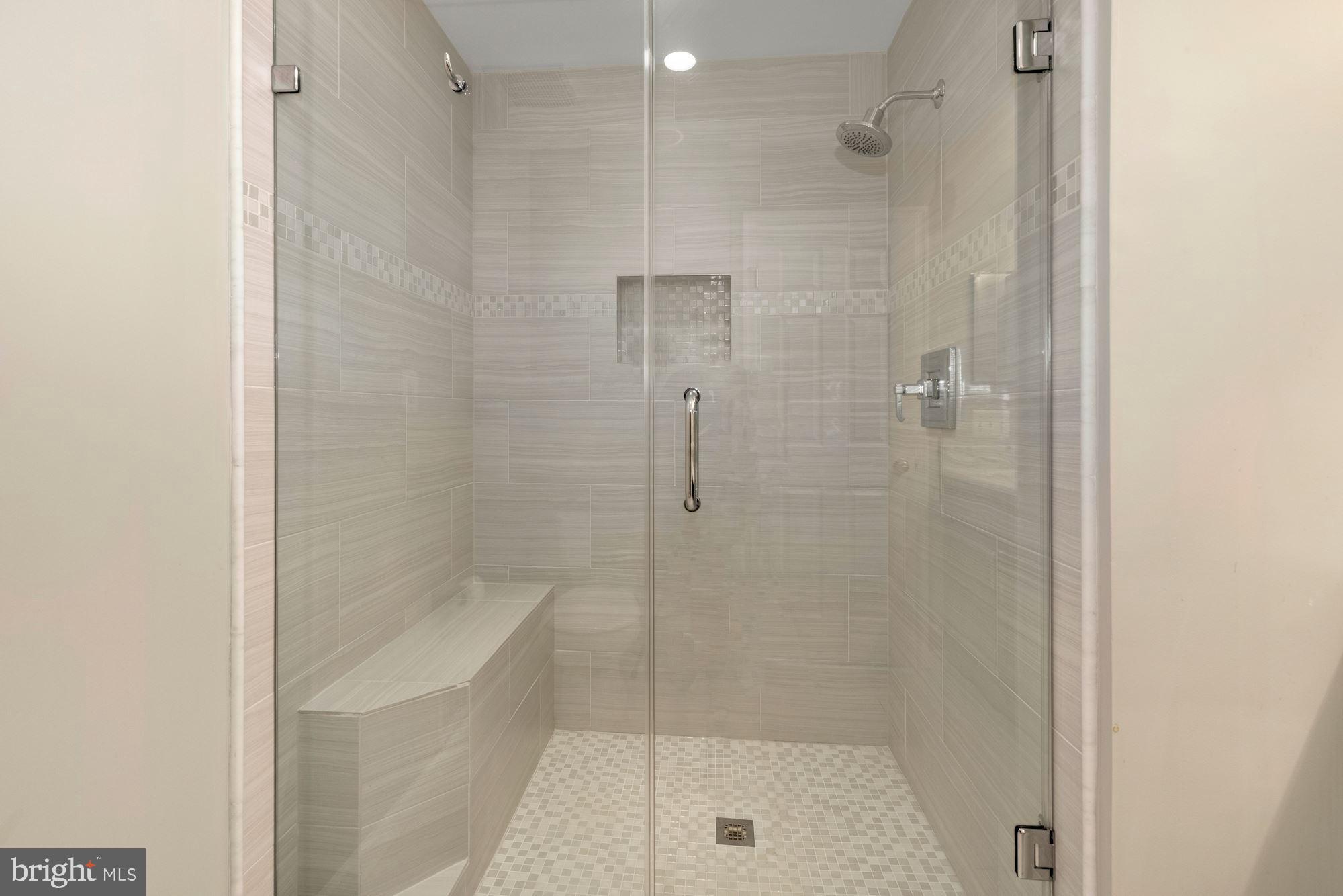 655 Main Street, Unit A Gaithersburg, MD 20878 - Photo 20 of 29 Large Frameless Marble Shower with Bench