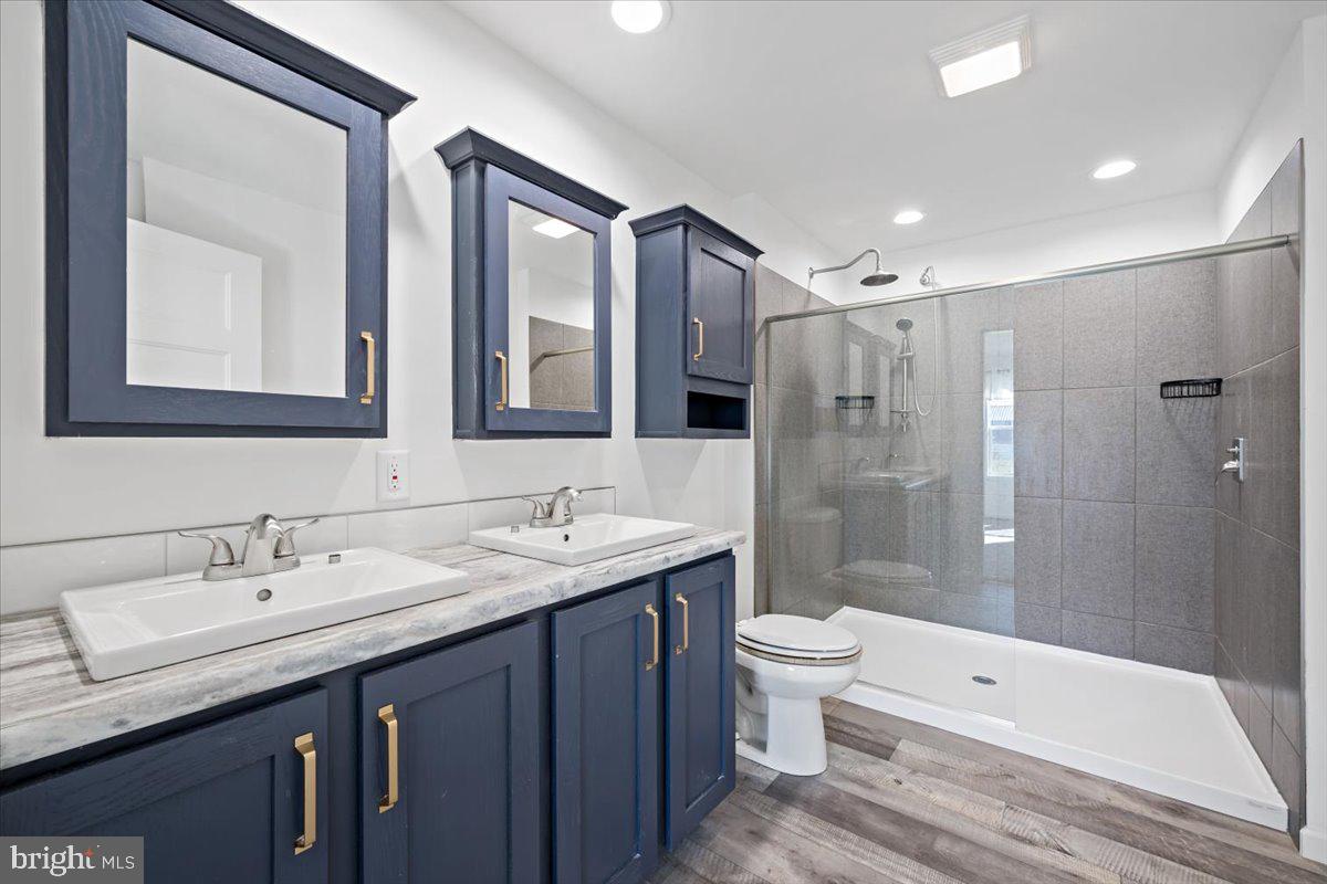 1410 Heytesbury Road Walnutport, PA 18088 - Photo 27 of 37 Sleek modern bathroom with dual sinks.