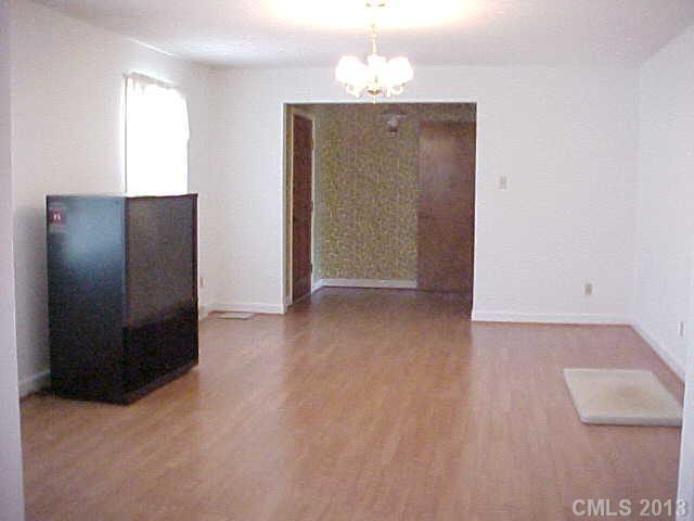 720 Belleview Road Rock Hill, SC 29730 - Photo 2 of 16 an empty room with wooden floor and windows