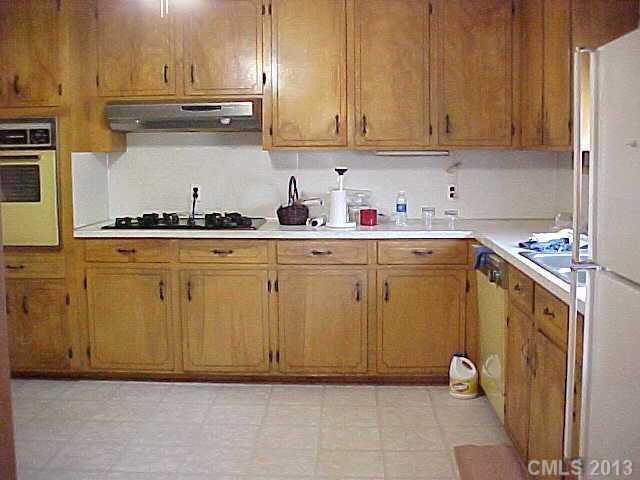 720 Belleview Road Rock Hill, SC 29730 - Photo 7 of 16 a kitchen with stainless steel appliances granite countertop a sink refrigerator and cabinets