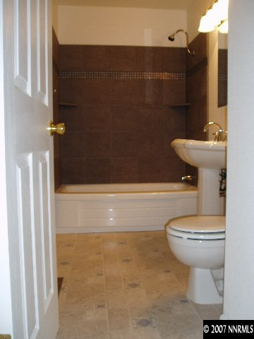 2140 Windsor Way Reno, NV 89503 - Photo 4 of 8 a bathroom with a toilet and a shower