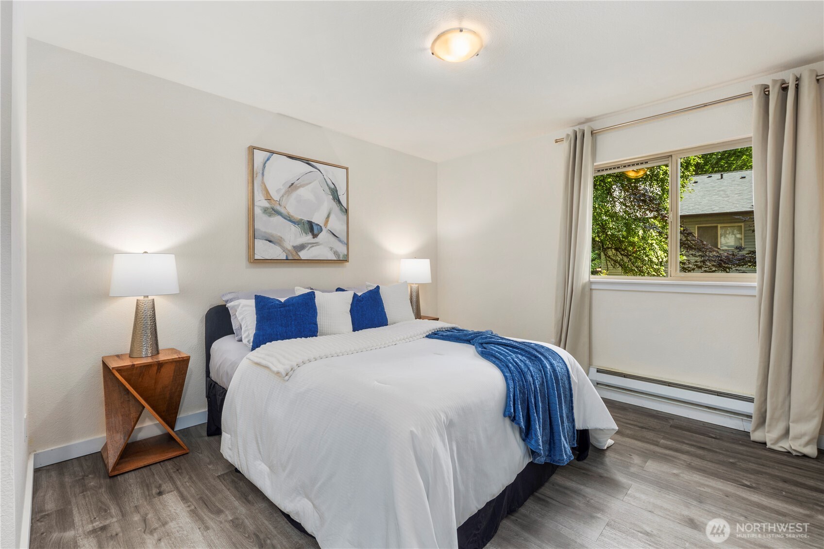 9805 Avondale Road Northeast, Unit L238 Redmond, WA 98052 - Photo 12 of 19 a bedroom with a bed and a window