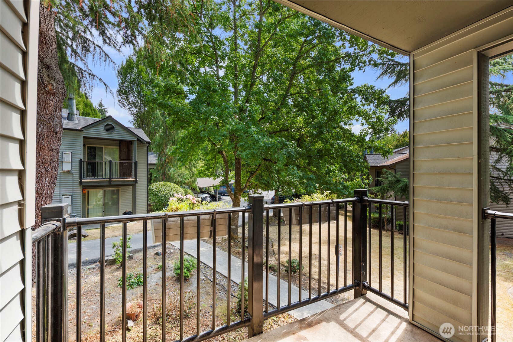 9805 Avondale Road Northeast, Unit L238 Redmond, WA 98052 - Photo 18 of 19 a view of a balcony with tree