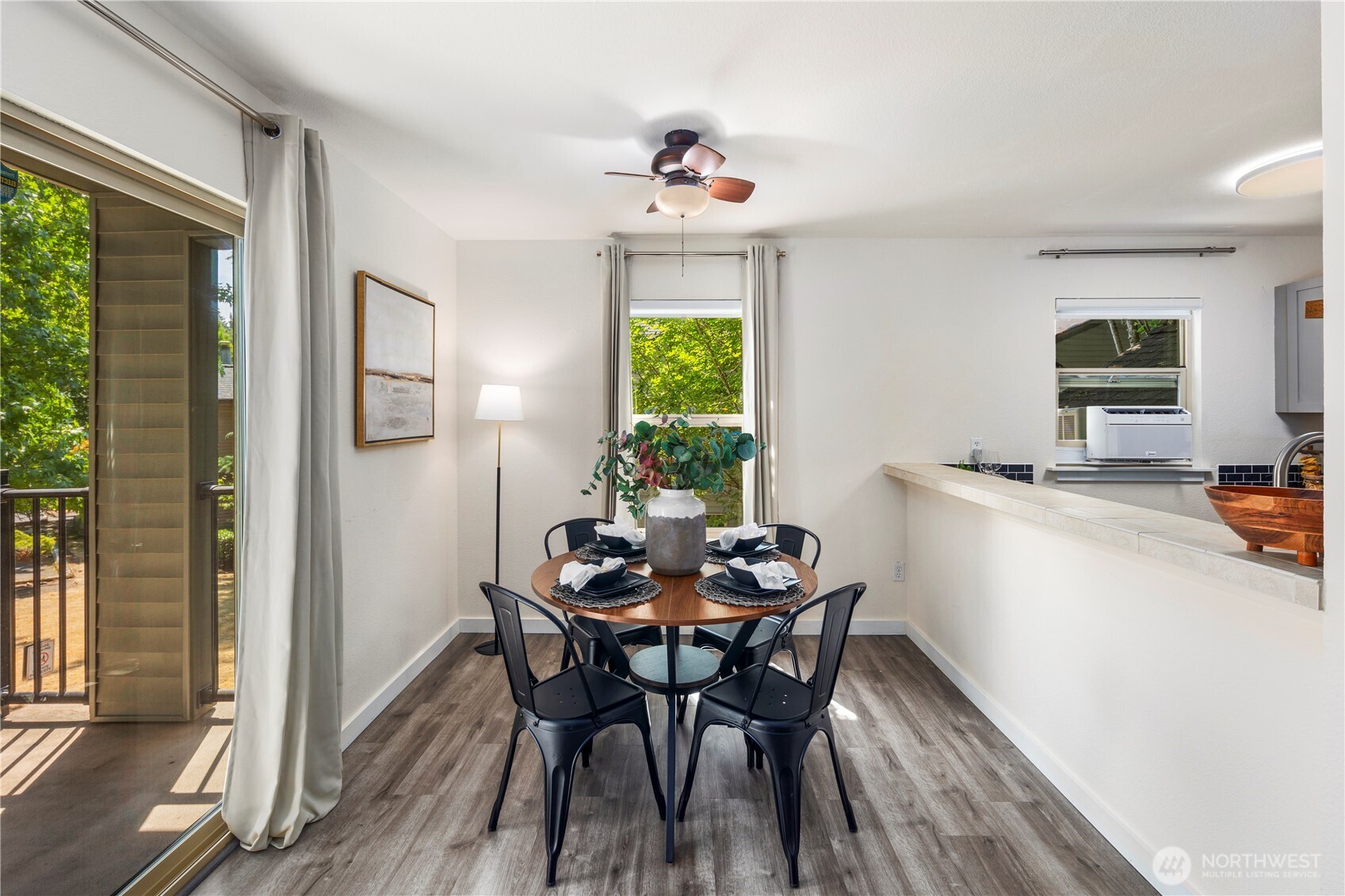9805 Avondale Road Northeast, Unit L238 Redmond, WA 98052 - Photo 4 of 19 a view of a dining room with furniture window and outside view
