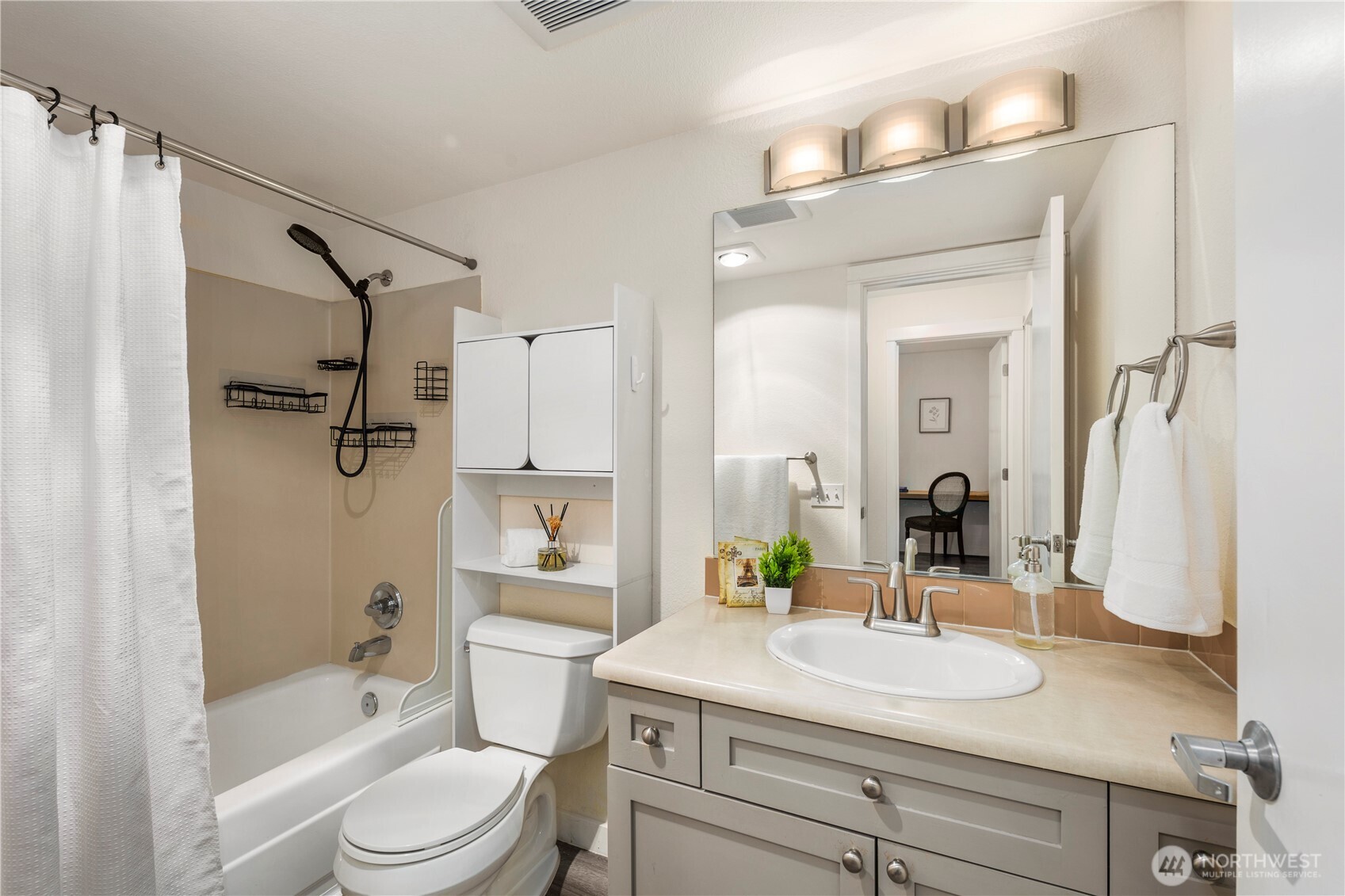 9805 Avondale Road Northeast, Unit L238 Redmond, WA 98052 - Photo 9 of 19 a bathroom with a sink a toilet and shower