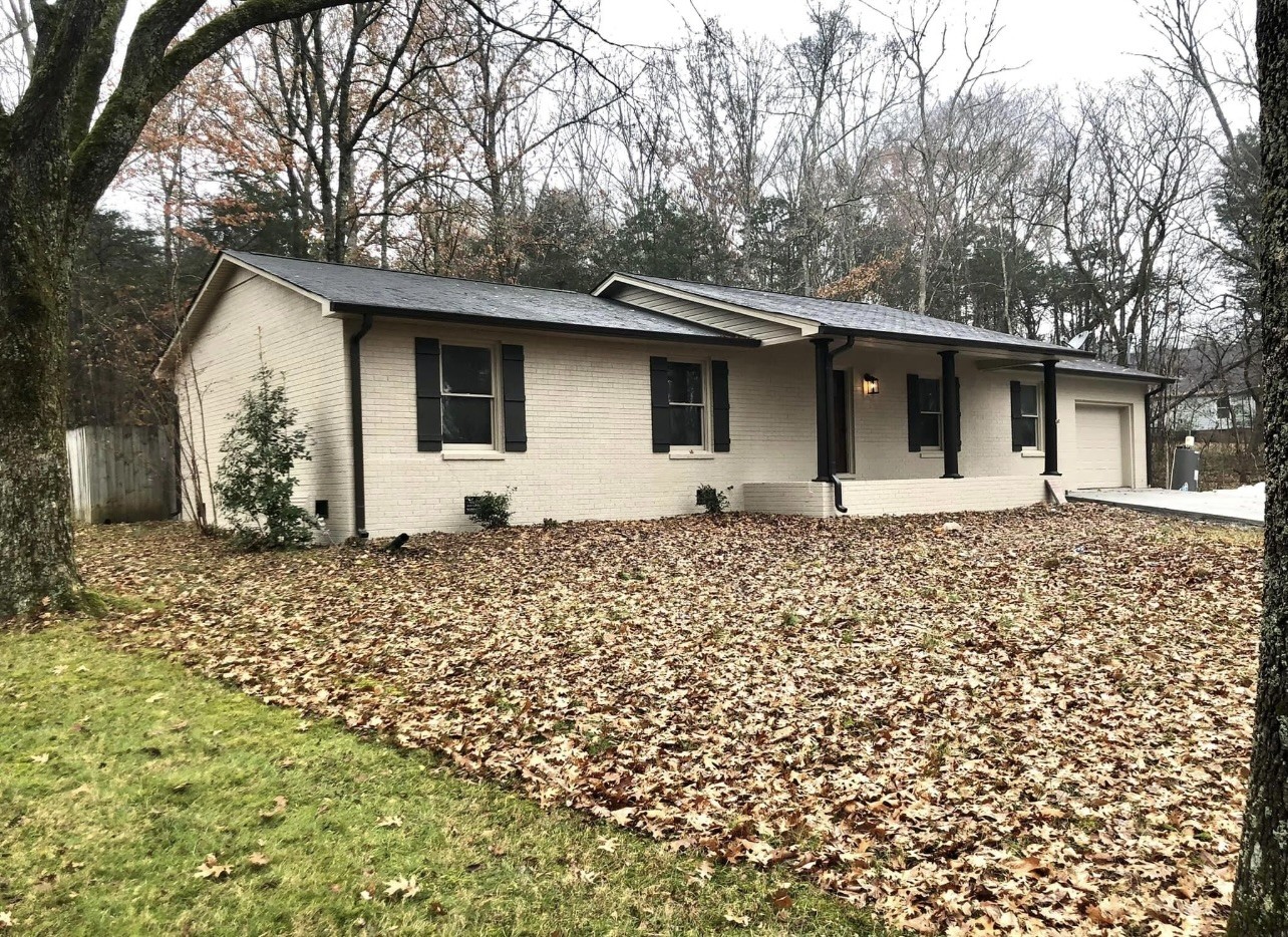 8913 Powells Chapel Road Murfreesboro, TN 37129 - Photo 1 of 15 a front view of a house with garden