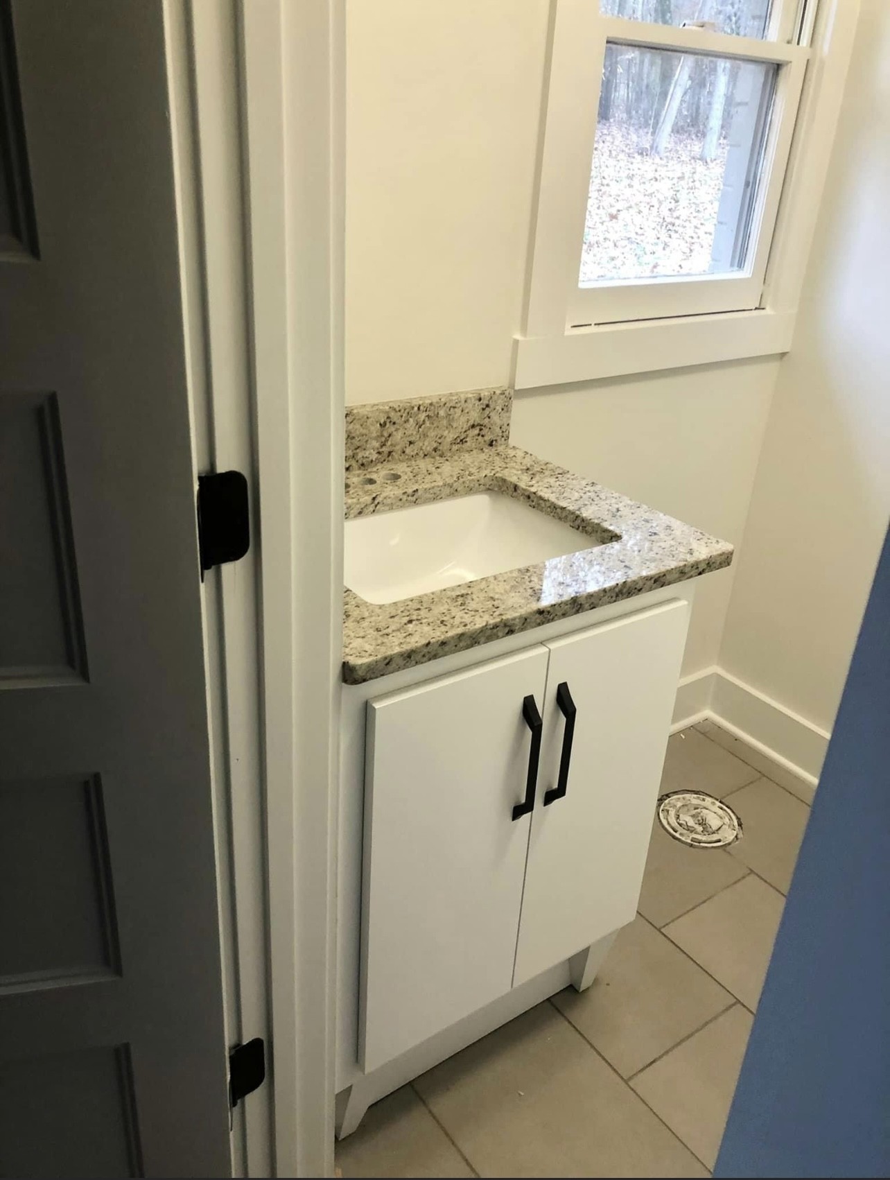 8913 Powells Chapel Road Murfreesboro, TN 37129 - Photo 12 of 15 a bathroom with a granite countertop sink and washing machine