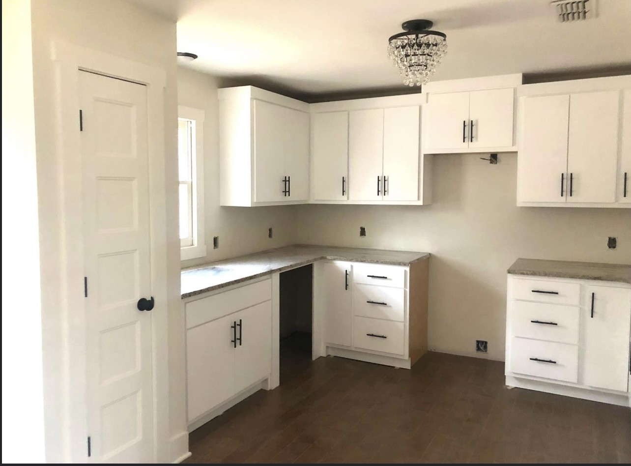 8913 Powells Chapel Road Murfreesboro, TN 37129 - Photo 6 of 15 a kitchen with white cabinets and white appliances