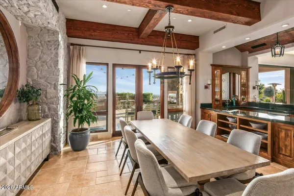 a kitchen with a sink a counter top space and stainless steel appliances