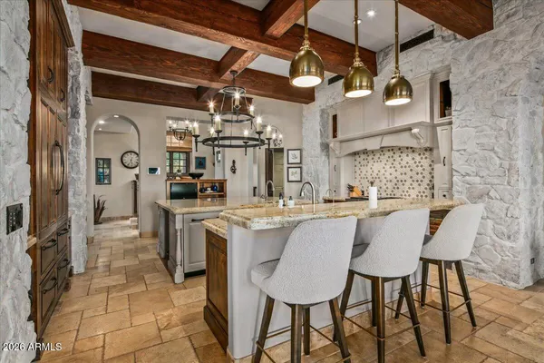 a view of a chairs and table in patio
