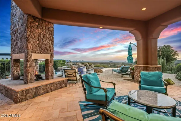 a living room with furniture and a floor to ceiling window