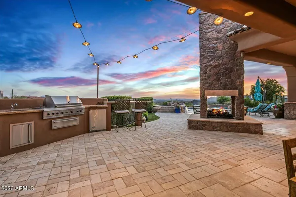 a spacious bathroom with a granite countertop sink mirror and bathtub