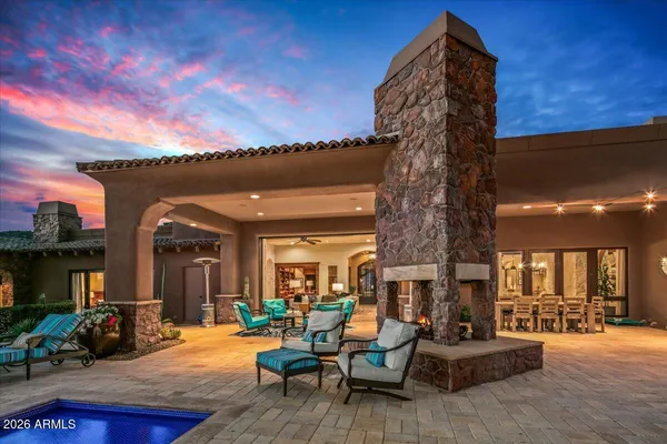 a living room with a book shelf and a book shelf