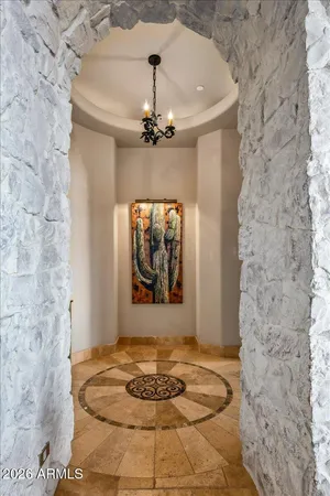 a bedroom with a large bed and a flat tv screen