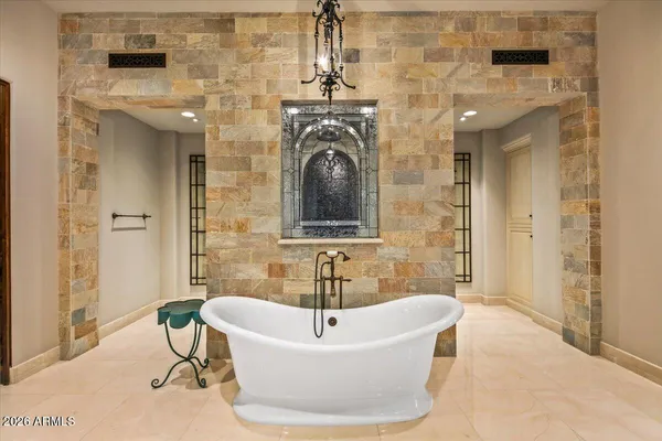 a dining room with furniture and window view