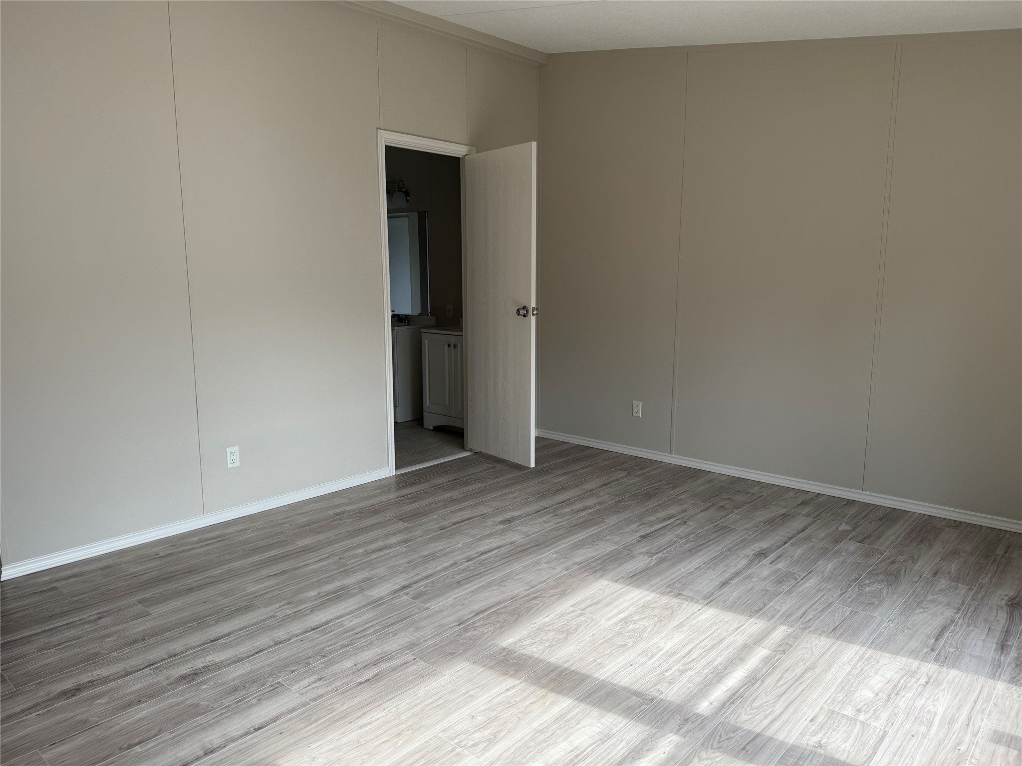 20701 Liveoak Lane Manor, TX 78653 - Photo 14 of 31 Spare room with a decorative wall and light wood-type flooring