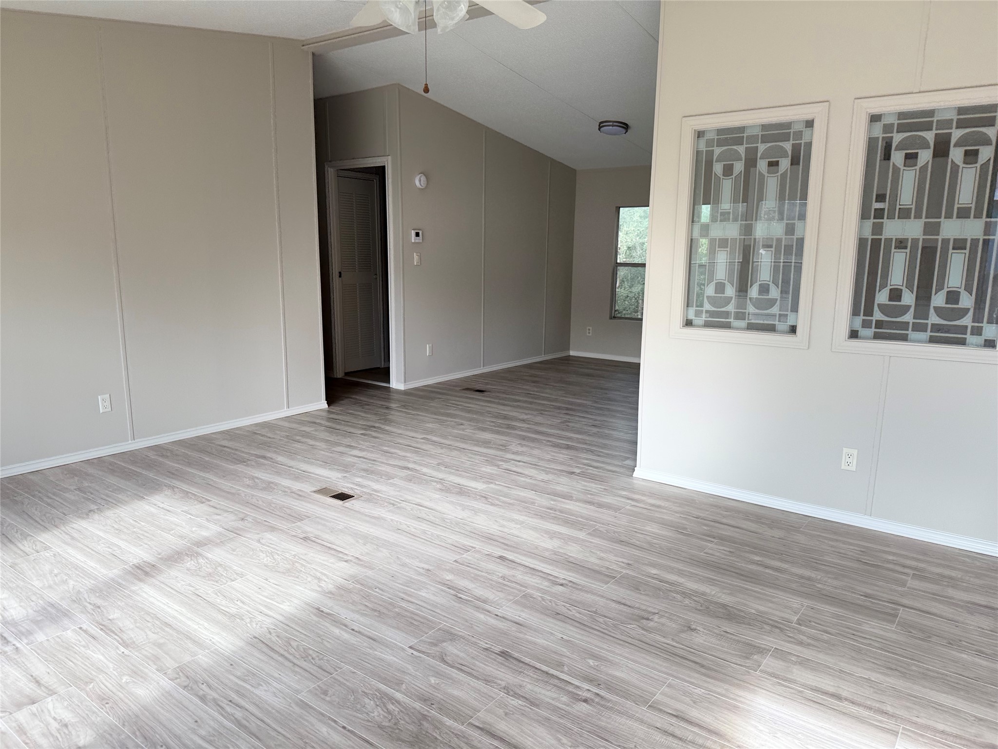 20701 Liveoak Lane Manor, TX 78653 - Photo 17 of 31 Spare room with light wood-style flooring and a ceiling fan