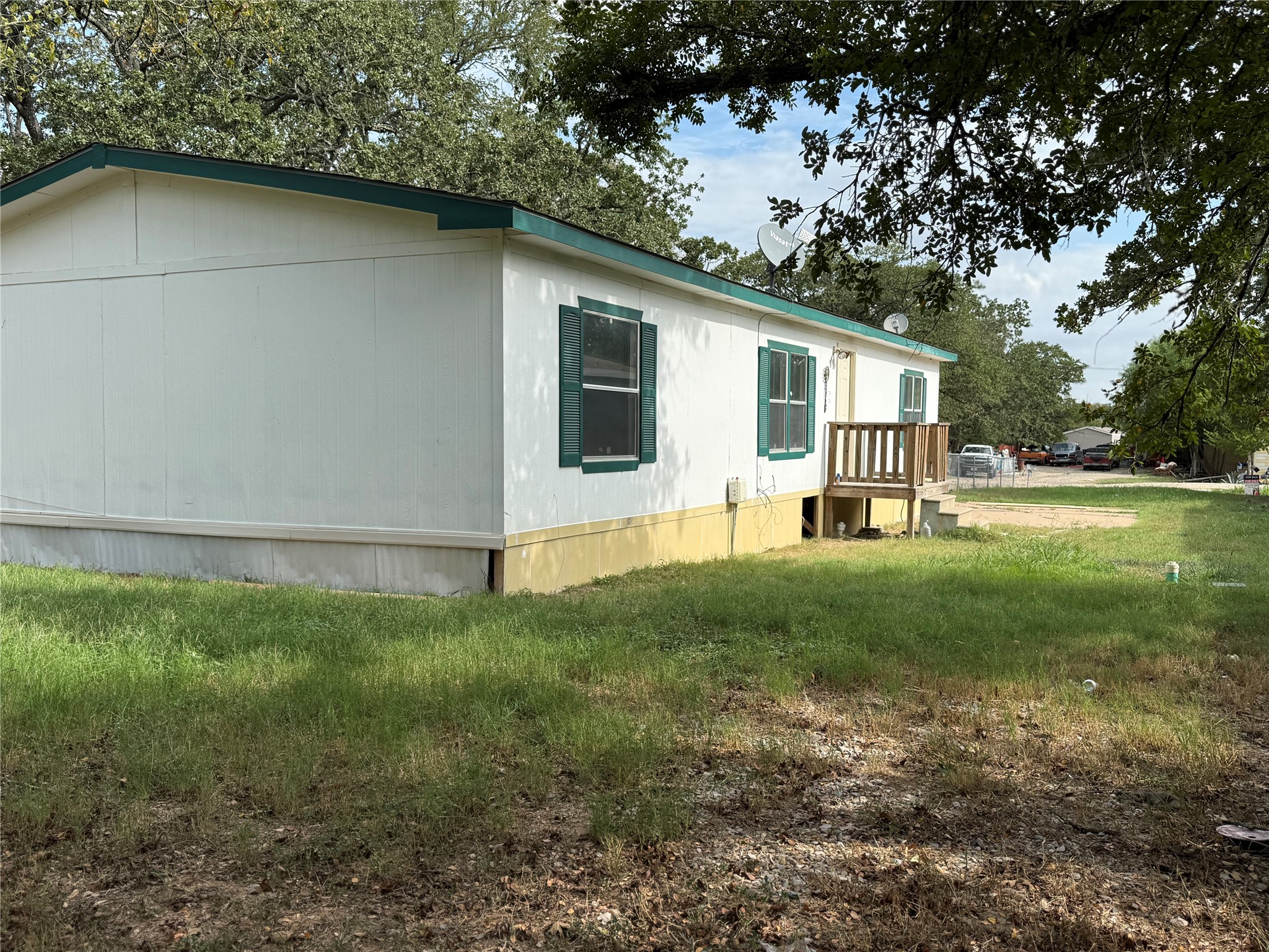 20701 Liveoak Lane Manor, TX 78653 - Photo 27 of 31 View of home's exterior featuring a lawn