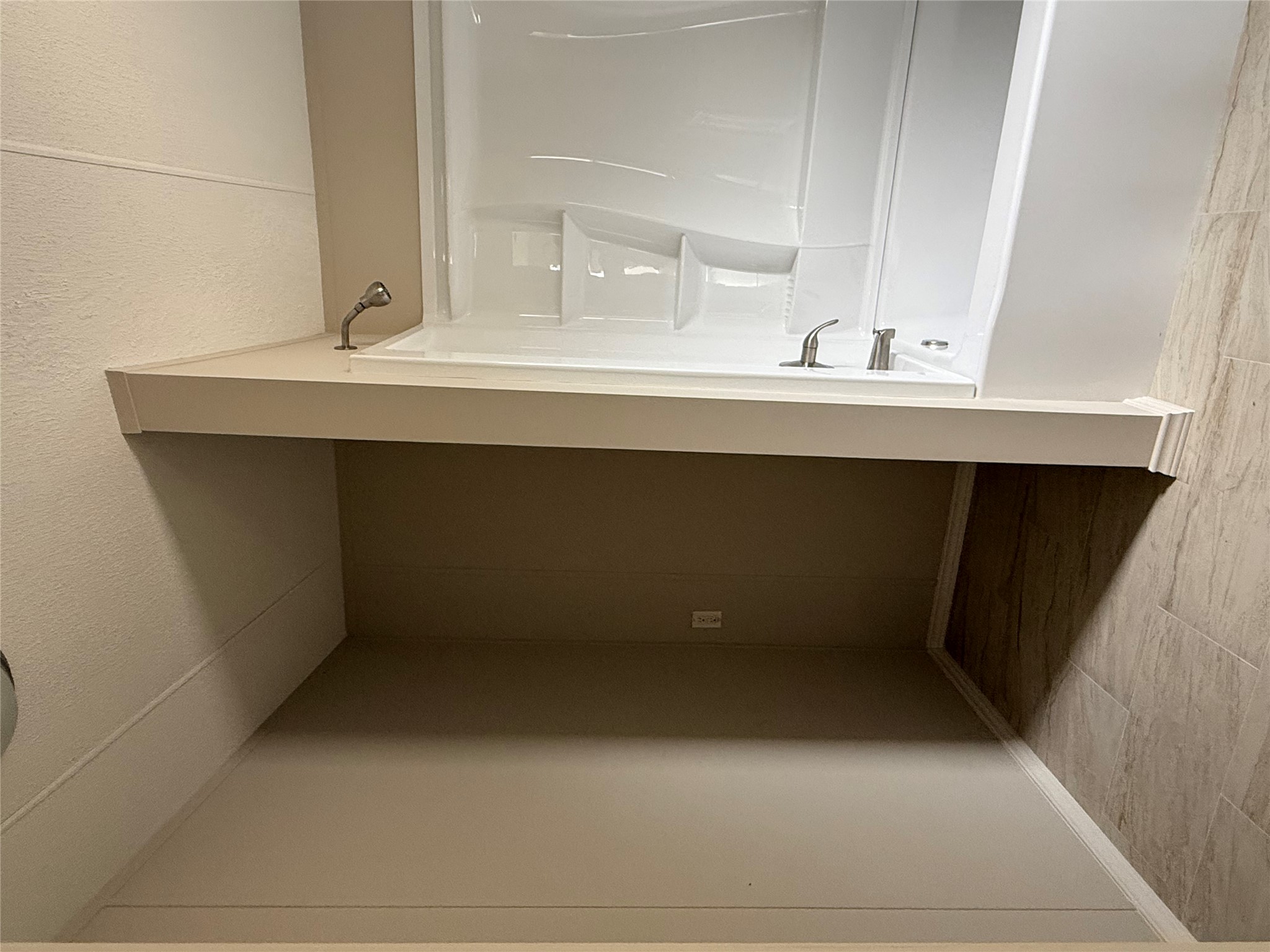 20701 Liveoak Lane Manor, TX 78653 - Photo 7 of 31 Bathroom featuring bathing tub / shower combination and a textured ceiling