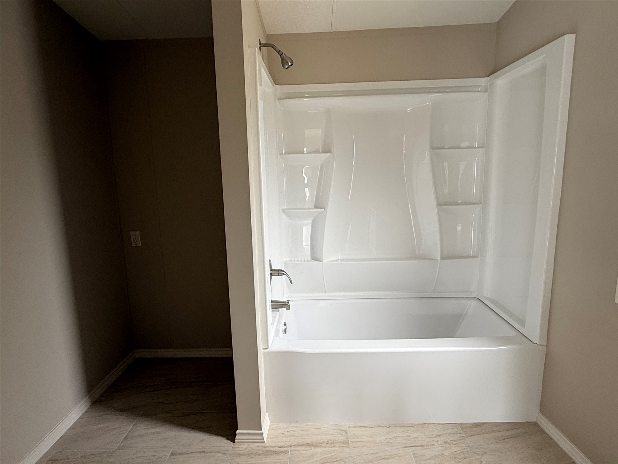 20701 Liveoak Lane Manor, TX 78653 - Photo 8 of 31 Bathroom featuring shower combination and baseboards