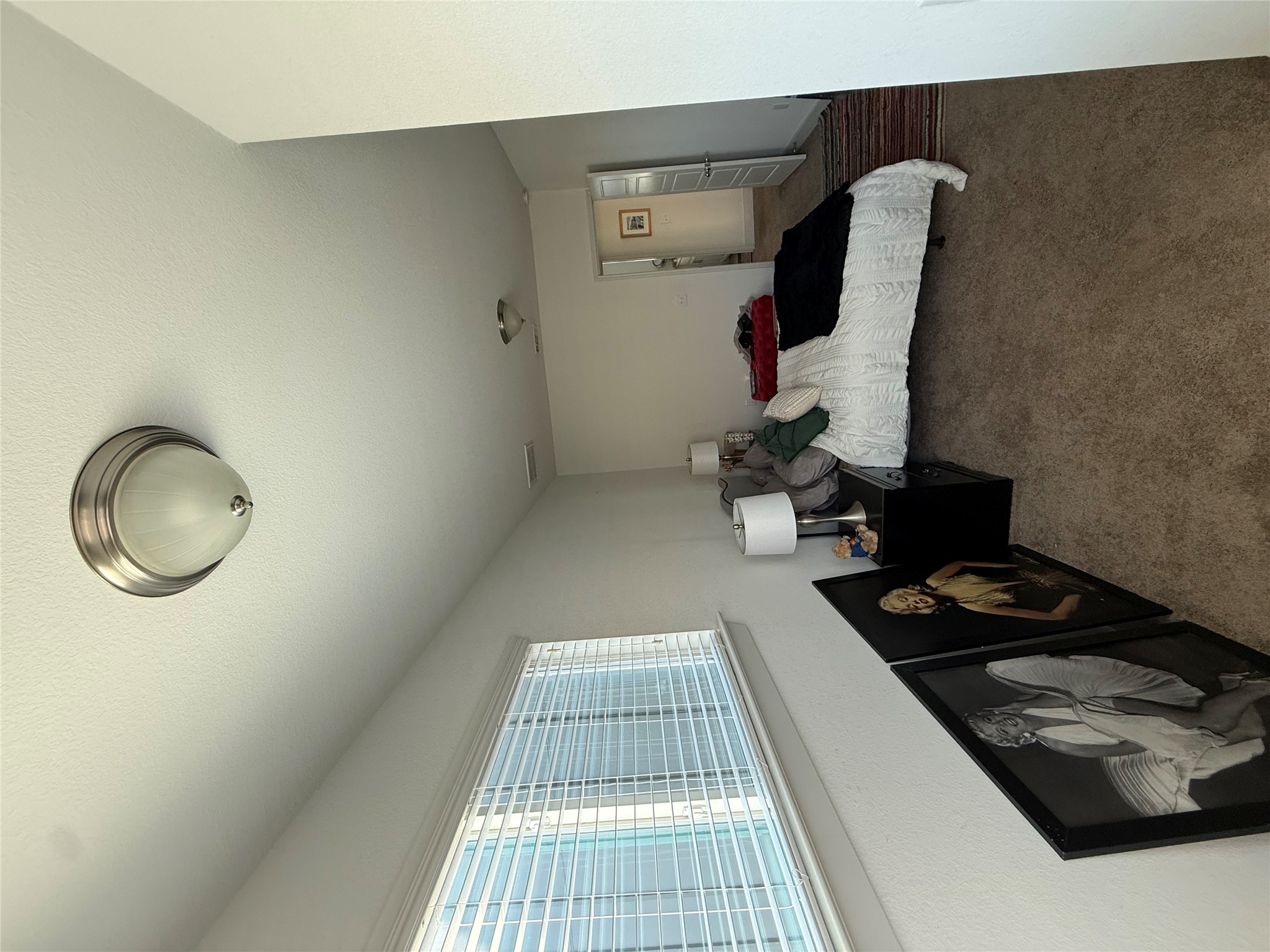 2214 Capulet Street Austin, TX 78741 - Photo 12 of 33 a bedroom with bed and a window