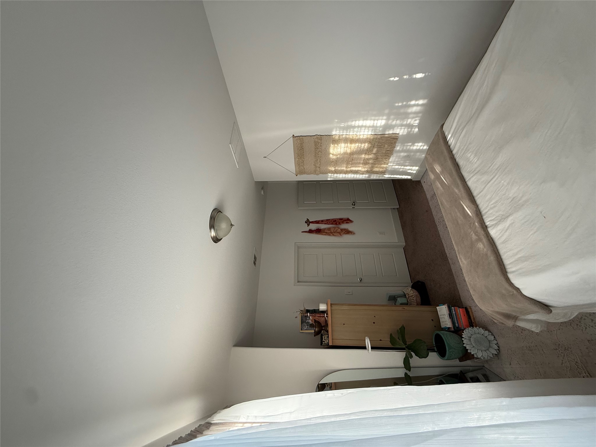 2214 Capulet Street Austin, TX 78741 - Photo 13 of 33 a bedroom with a bed closet and a window