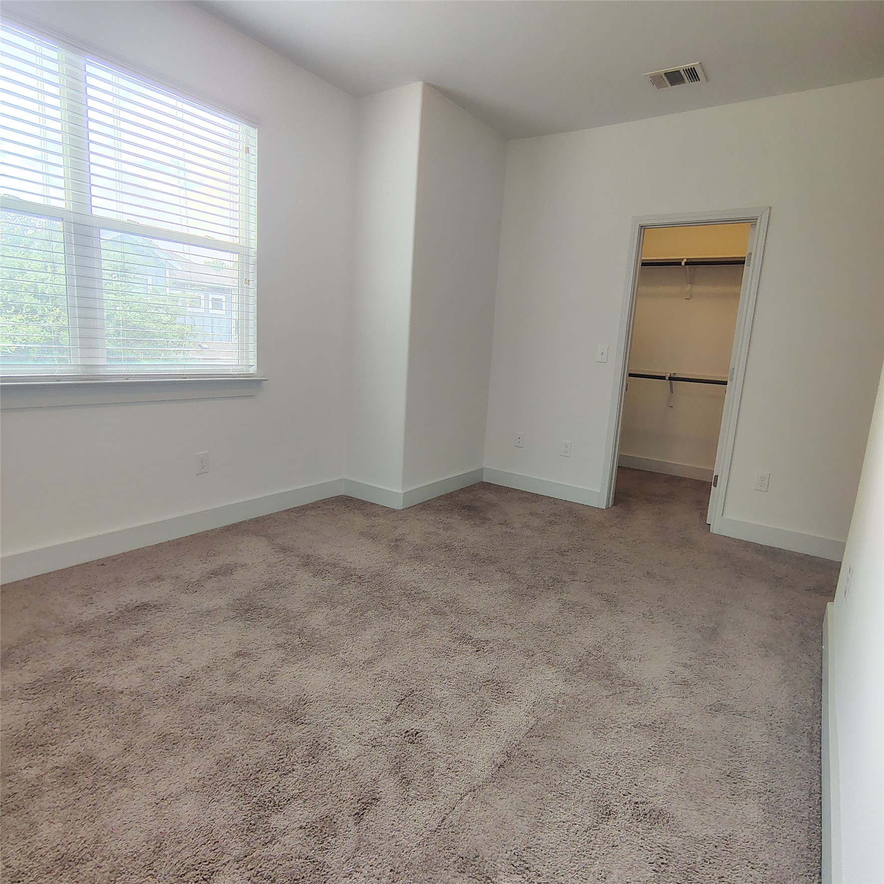 2214 Capulet Street Austin, TX 78741 - Photo 17 of 28 Bedroom 2 featuring a walk in closet