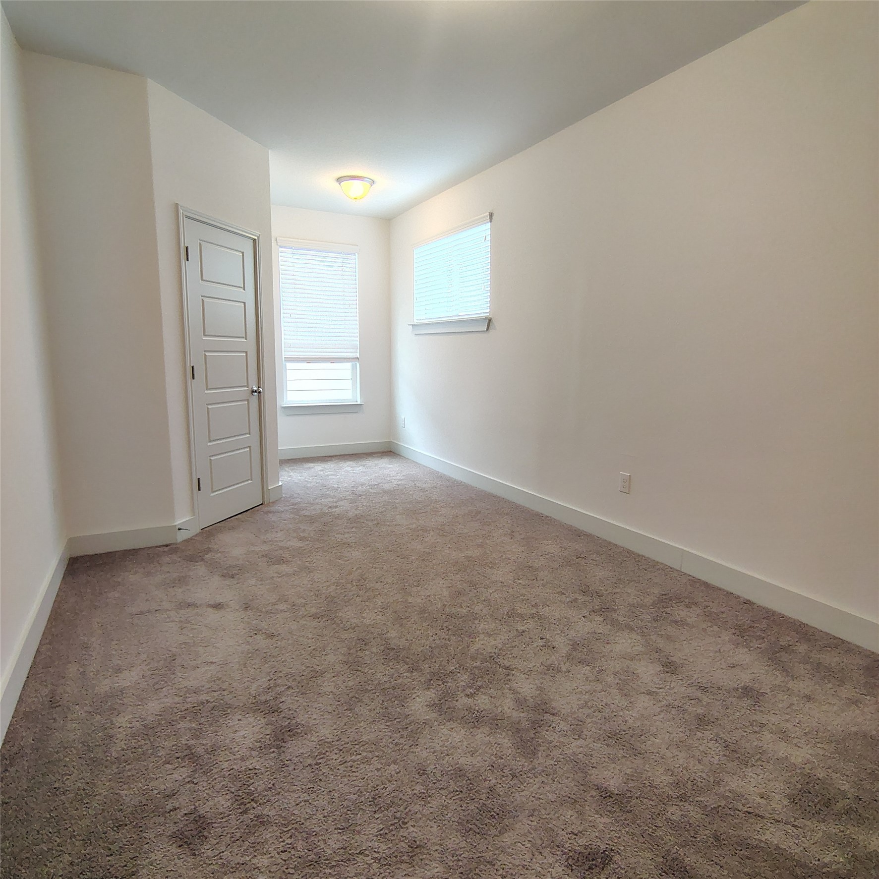 2214 Capulet Street Austin, TX 78741 - Photo 20 of 28 3rd Bedroom with light colored carpet and baseboards