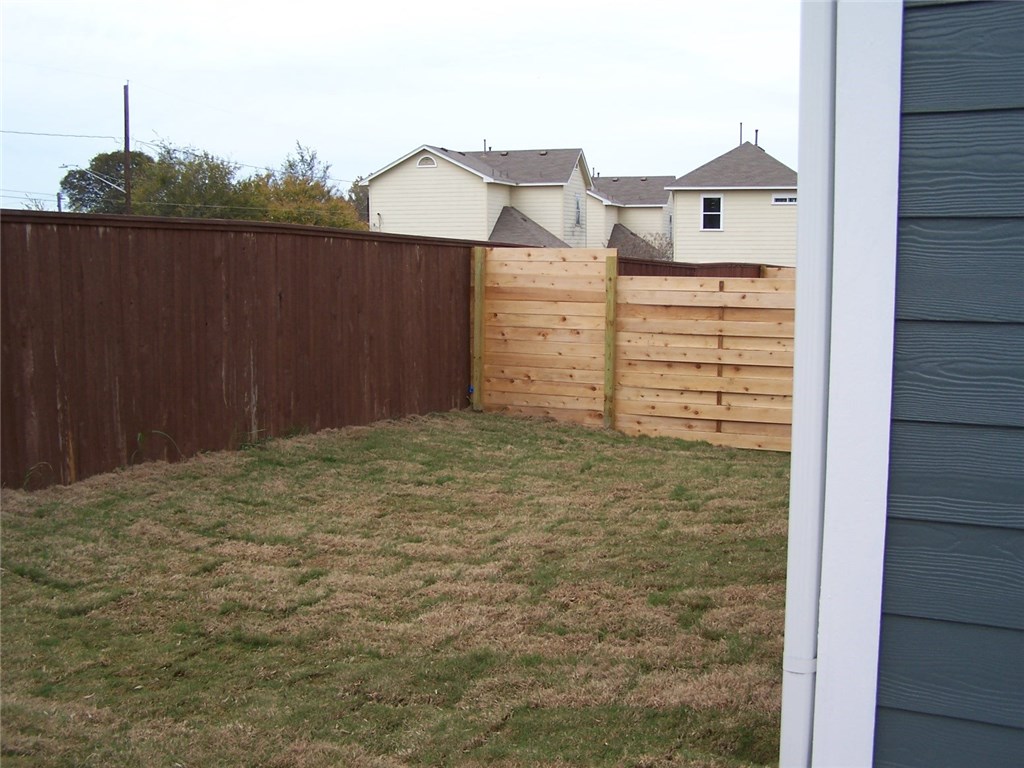 2214 Capulet Street Austin, TX 78741 - Photo 31 of 33 a view of a house with a backyard