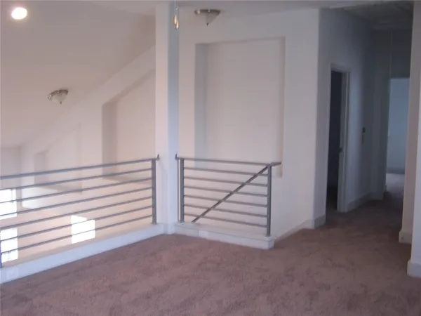a view of a livingroom with stairs