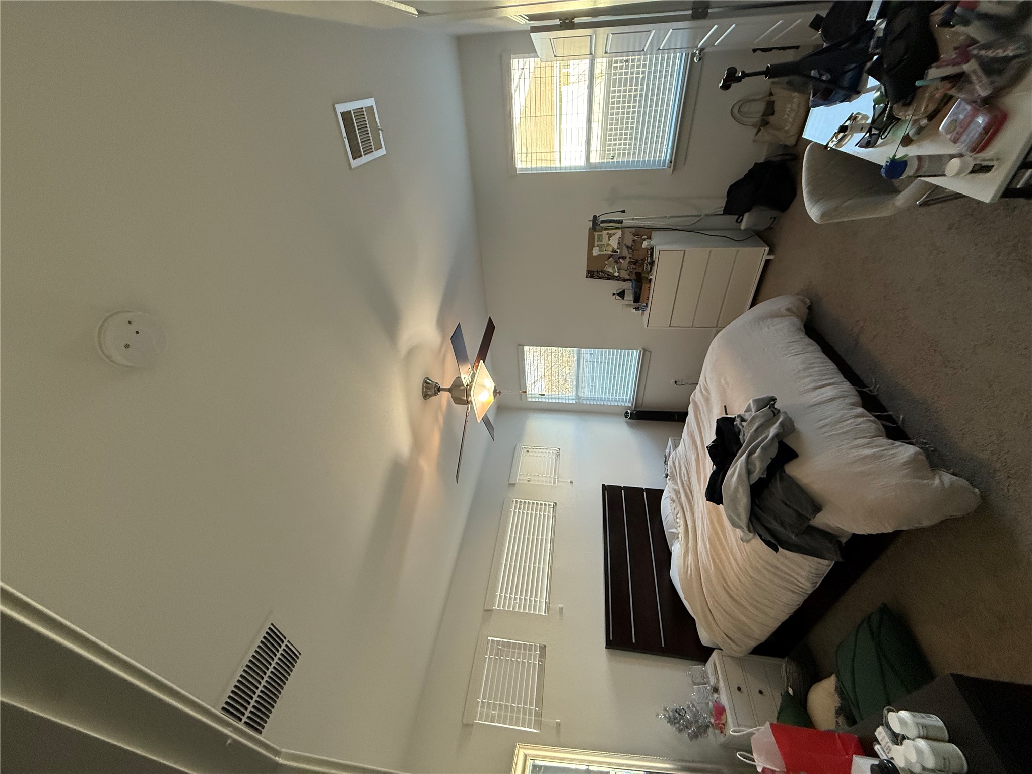 2214 Capulet Street Austin, TX 78741 - Photo 8 of 33 a bedroom with bed couch and window