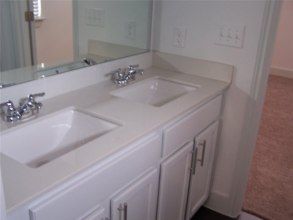 2214 Capulet Street Austin, TX 78741 - Photo 10 of 33 a bathroom with a sink and a mirror
