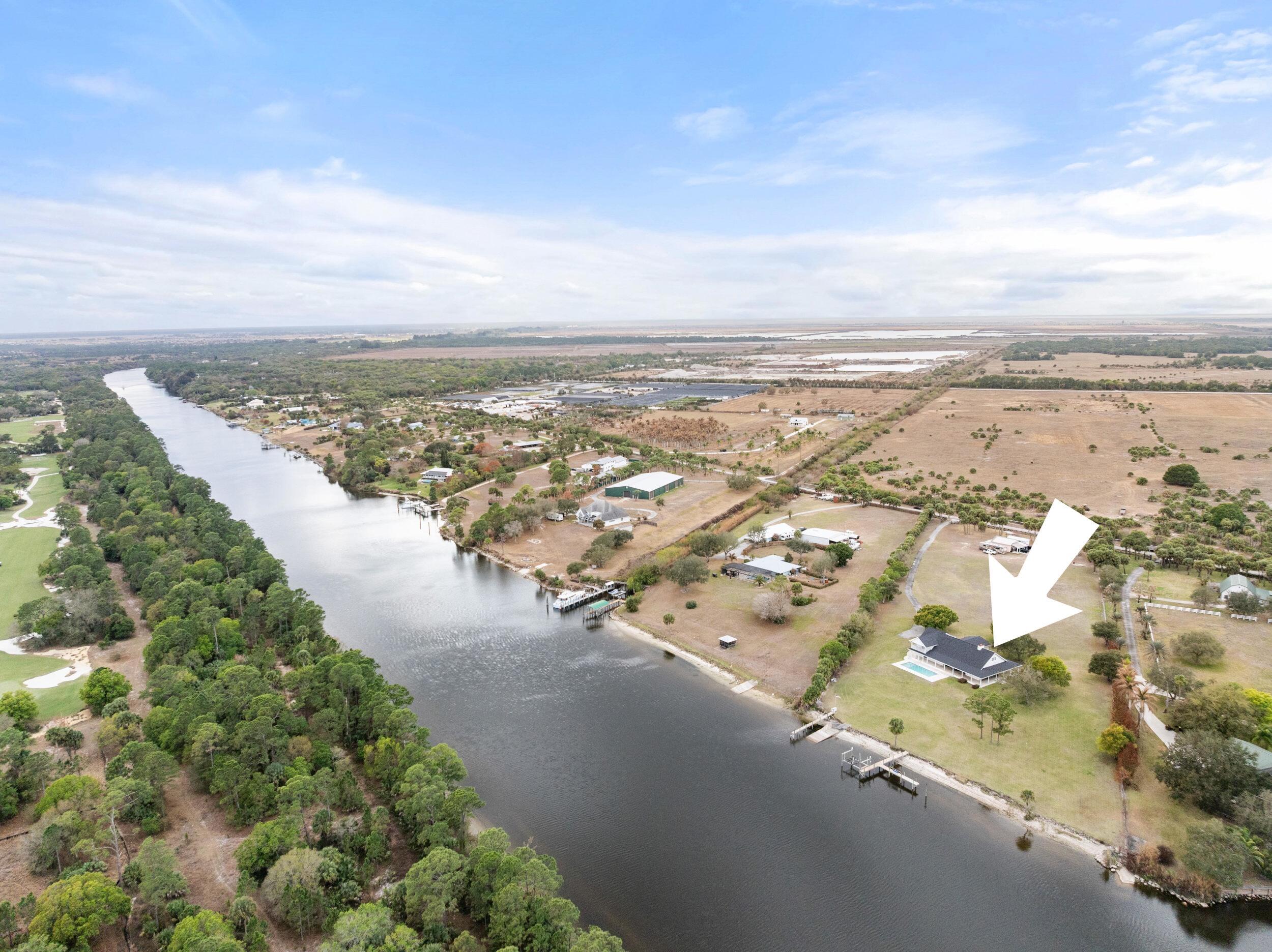 10125 Southwest Green Ridge Lane, Unit LANE Palm City, FL 34990 - Photo 2 of 87 69_dji_20260227040034_0139_d.1