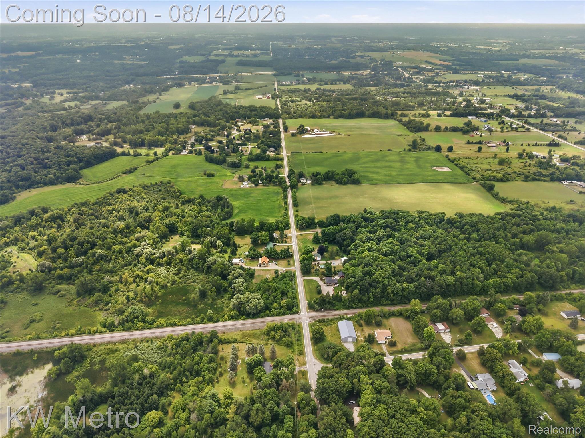201 South Maple Leaf Road Lapeer, MI 48446 - Photo 63 of 70 Expansive rural landscape featuring wooded areas, cultivated fields, and established roadways