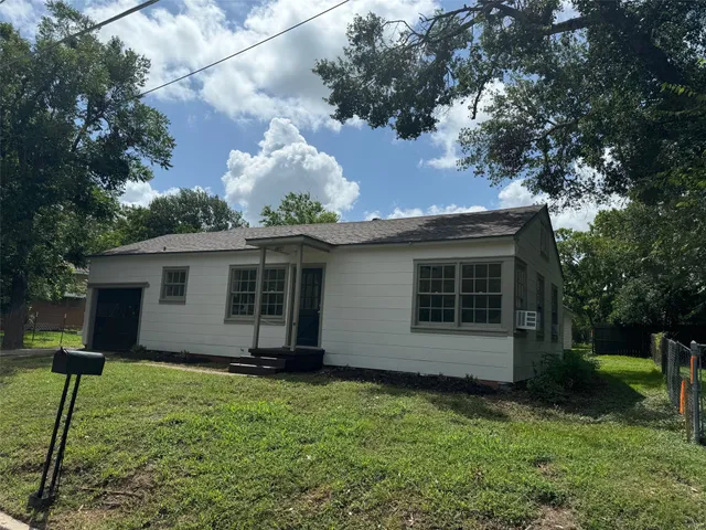 a view of a house with a garden