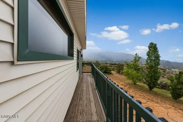 a view of balcony with furniture