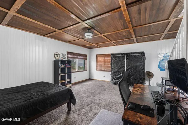 a bedroom with furniture and a window