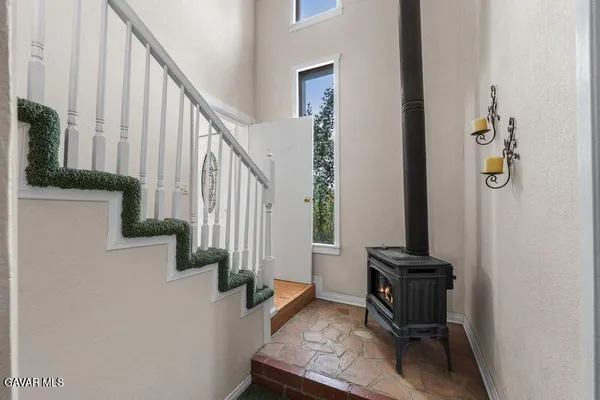 a view of a hallway with furniture and entryway