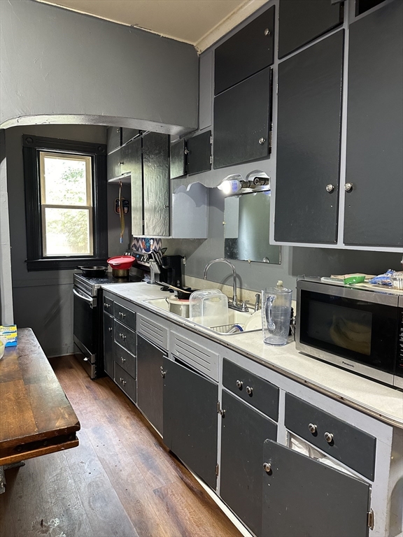 35 Cliftwood Street Springfield, MA 01108 - Photo 4 of 11 a kitchen with a sink cabinets and window