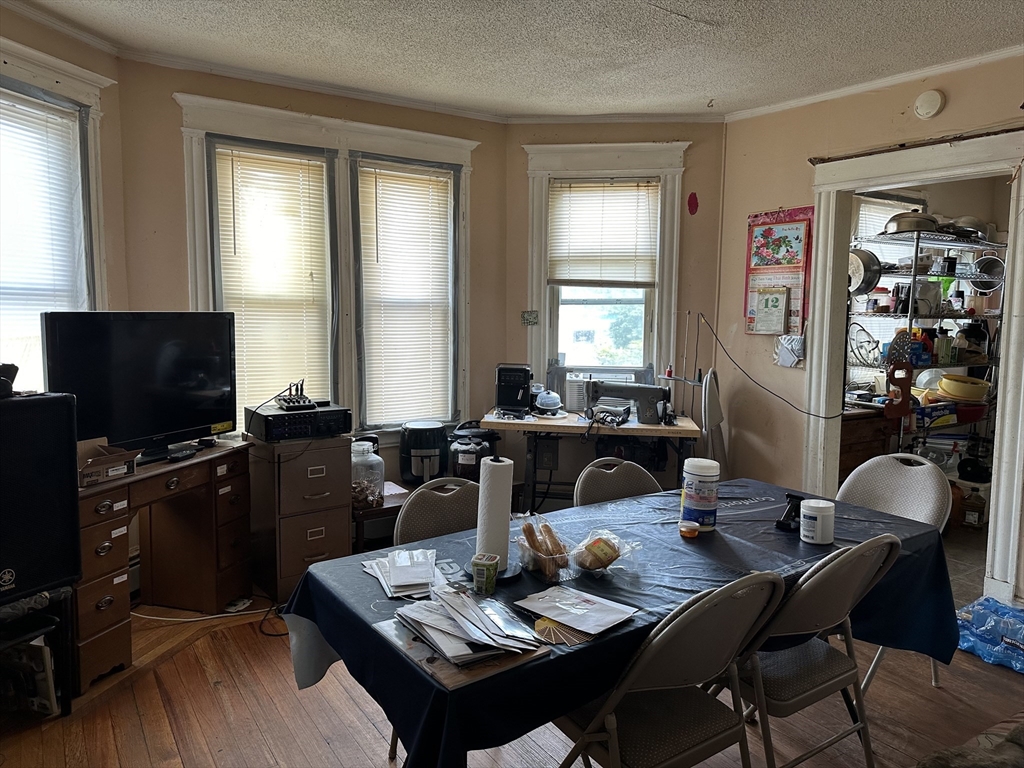 35 Cliftwood Street Springfield, MA 01108 - Photo 5 of 11 a living room with furniture a flat screen tv and a window