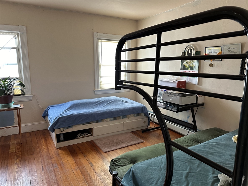 35 Cliftwood Street Springfield, MA 01108 - Photo 7 of 11 a bedroom with furniture and a wooden floor